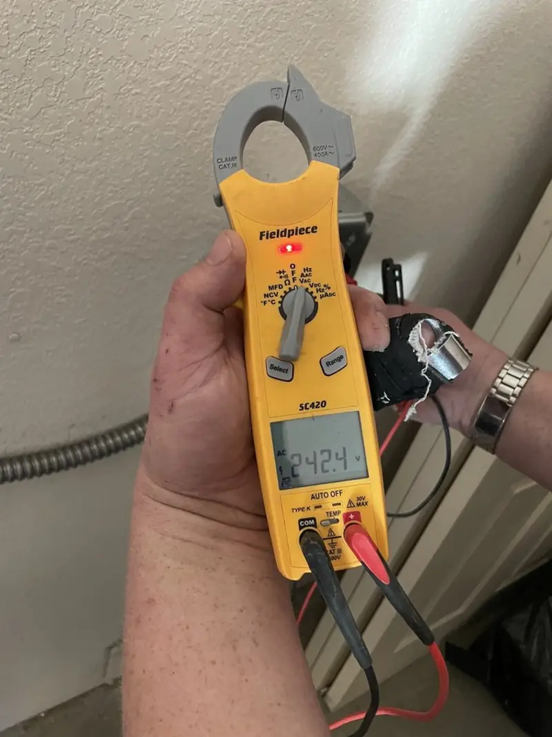 Voltage testing with clamp meter during Outlet Installation in Willington
